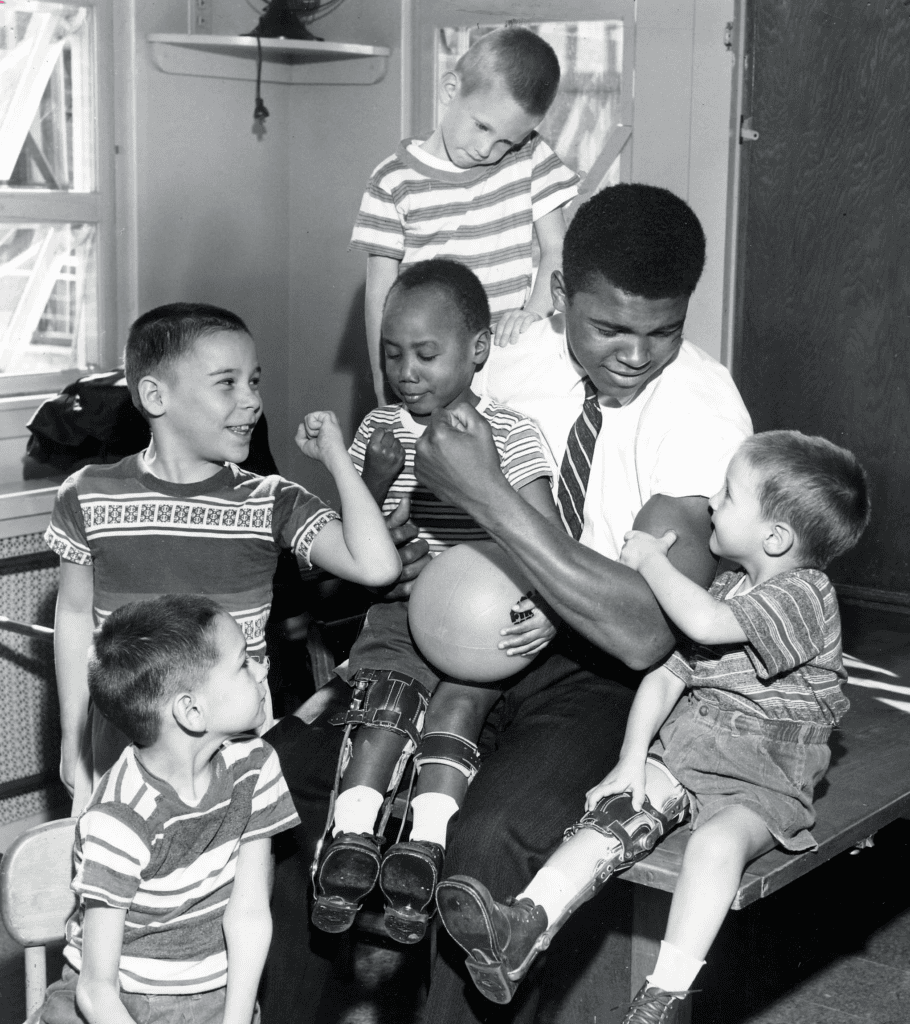 Muhammad Ali surrounded by children